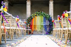 an outdoor ceremony with colorful streamers and chairs