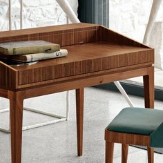 a wooden desk with a book on it