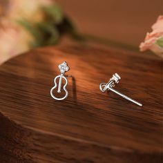 Description & Details Because the musical note symbolizes romance and happiness, and the musical note can give people a unique and dynamic feeling, it means that it can dance like a beating note. • Material: Solid 925 Sterling Silver ∙ Cubic Zirconia • Finish: Hypoallergenic ∙ Gold Plating• Dimensions: 5 x 11 mm each• All our work is custom made by hand with love Violin Earrings, Music Note Earrings, Engagement Watch, Art Watch, Jewellery Brand, Musical Note, Three Stone, Ring Bracelet, Jewelry Branding