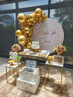 a table with some gold balloons on it