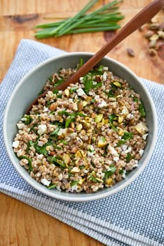 a bowl filled with food sitting on top of a wooden table