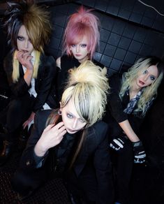 three women with blonde hair posing for the camera