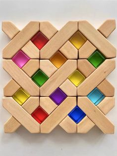 a wooden puzzle with different colored squares on it