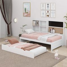 a white bed sitting next to a book shelf on top of a wooden floor in a bedroom