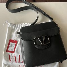 Valentino Loc Crossbody Calfskin Bag Drop Length: 55 Cm / 19.6 In. W23xh25xd6 Cm / W9x9.8xd2.3 In. Brand New In Box Includes Dust Bag, Tag Elegant Logo Crossbody Shoulder Bag, Elegant Rectangular Shoulder Bag With Logo, Designer Rectangular Shoulder Bag With Logo, Luxury Rectangular Shoulder Bag With Logo, Luxury Crossbody Shoulder Bag With Logo, High-end Top Handle Bag With Logo, Elegant Shoulder Bag With Logo, Elegant Logo Shoulder Bag, Top Handle Shoulder Bag With Logo For Evening