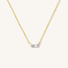 Our Dainty Baguette Necklace is the sweetest little everyday necklace. The cubic zirconia sparkles at every angle! Wear it alone for the perfect minimalist look, or layer it with your other favorites. DETAILS Necklace length: 16" with 2" extender 14k gold vermeil -or- sterling silver charm with cubic zirconia 14k gold filled -or- sterling silver spring clasp, chain, & findings Safe for sensitive skin & shower safe Matching ring: Dainty Baguette Ring Baguette Necklace, Dainty Initial Necklace, Detailed Necklace, Baguette Ring, Matching Ring, Gold Filled Ring, Classy Jewelry, Ethical Jewelry, Everyday Necklace