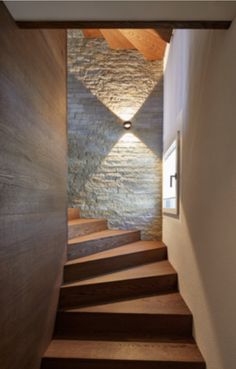 the stairs are made of wood and stone