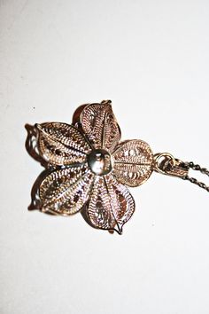 Vintage sterling silver filigree flower pendant necklace. Good condition, minor wear commensurate to age. Hallmarked on back. See photos for measurements. Antique Necklaces With Large Flower Pendant, Handmade Vintage Necklace With Flower Shape, Vintage Handmade Flower Shaped Necklaces, Vintage Handmade Flower Shape Necklaces, Handmade Vintage Flower Shape Necklaces, Vintage Handmade Flower Shaped Necklace, Vintage Sterling Silver Flower Pendant Necklace, Vintage Sterling Silver Flower Necklace, Vintage Silver Flower-shaped Necklace