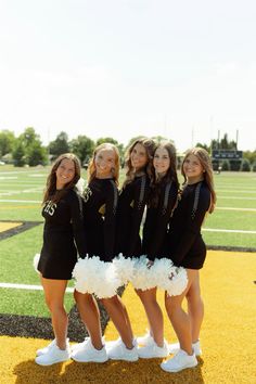 the cheerleaders pose for a photo before their game