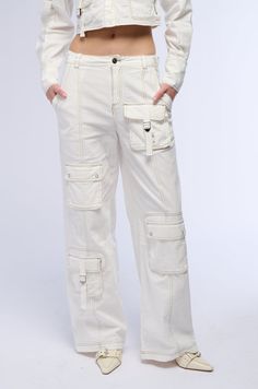 Nailing the trends in The AKIRA Label Aced It Wide Leg Cargo Pant. These slightly stretchy cotton bottoms feature a high rise waist, functional belt loops, contrast stitching, faux hematite metallic hardware, waist-cinching buckled straps at the sides, and a wide leg silhouette. Complete with side slant front pockets, one back zippered pocket and one snap button flap back pocket, two buckled strap cargo pockets on the front as well as two snap button flap pockets, and a front zip button closure. For a finished look, style with the coordinating AKIRA Label Aced It Long Sleeve Cargo Button Down.  - Shell: 100% Cotton - Some Stretch - Imported  (all measurements are approximate from size small) - 12” Rise - 31” Inseam - Model is 5’9” Product ID: 391934  (all measurements are approximate from Cotton Bottoms, Cargo Pant, Cinched Waist, Flap Pocket, Snap Button, Casual Pants, Wide Leg, High Rise, Zipper