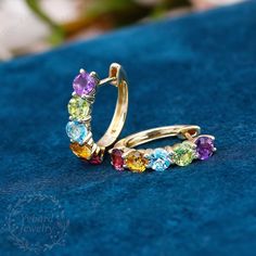 "❤Jewelry Details -Gold Type:  Solid 10K Gold / Solid 14K Gold / Solid 18K Gold (Choose One in Material Option) Stone Type: Natural Colored Gemstone (Red Tourmaline, Citrine, Blue Topaz, Peridot, Amethyst) Total Carat Weight: Approximately 3.0ct , 4.0mm*10pcs Color: 3A Clarity: VS Cut: Round Cut / 3EX Earrings Form Factor Size: 17*16mm SKU: YE0060 ❤The link for the same style ring is https://www.etsy.com/listing/1274158309/natural-colored-gemstone-ring-women?click_key=11c07786afd07133520572023a3bbb8601a786c9%3A1274158309&click_sum=69310cc3&ref=shop_home_active_20&pro=1&frs=1&sts=1 ❤The link for the same style pendant is https://www.etsy.com/listing/1260149690/round-cut-natural-colored-gemstone?click_key=17446ef01b4277e7f3d0363bad383bd417151a40%3A1260149690&click_sum=998eccd6&ref=shop_home_ Yellow Gold Birthstone Huggie Earrings For Anniversary, Anniversary Yellow Gold Huggie Earrings With Birthstone, Elegant Multi-stone Hoop Jewelry, 14k Gold Huggie Earrings With Birthstone For Anniversary, Gold Multi-stone Cubic Zirconia Earrings, Elegant Multi-stone Hoop Earrings, Multicolor 14k Gold Jewelry For Wedding, Multicolor Round Hoop Earrings For Wedding, Yellow Gold Hoop Earrings With Birthstone For Anniversary