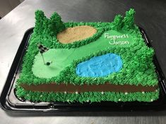 a golf themed cake is sitting on a table