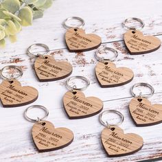 wooden heart shaped key chains with names engraved on them, set of 12 pieces in the shape of hearts