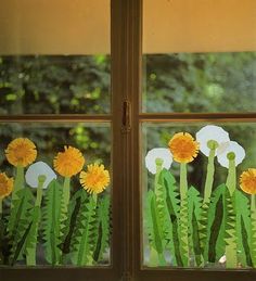 the window is decorated with flowers and grass