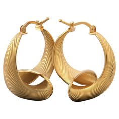 Elevate your style with our 24 mm Diameter Hoop Earrings in 18k Gold, a harmonious blend of Italian craftsmanship and modern innovation. These captivating earrings boast a striking fusion of classic beauty and futuristic design, handcrafted in Italy. Crafted with precision, these hoops feature a 24 mm diameter, framing your face with timeless elegance. What sets them apart is their innovative silhouette, effortlessly bridging the gap between contemporary and classic styles. Choose between 18k an Modern Plated Hoop Earrings For Gift, Contemporary Yellow Gold Hoop Earrings For Formal Occasions, Modern Hallmarked Huggie Earrings, Modern Twist Yellow Gold Earrings With Polished Finish, Modern Twist Polished Yellow Gold Earrings, Luxury Gold-plated Polished Hoop Earrings, Modern Shiny Gold Plated Earrings, Luxury Gold Plated Polished Hoop Earrings, Modern Shiny Gold-plated Earrings