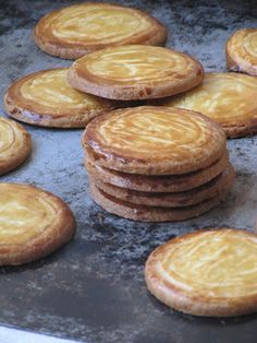 there are many pastries that are on the baking sheet and ready to be baked