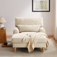 a chair with a blanket on it in a living room