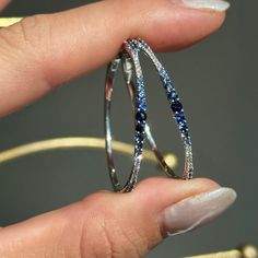 14KT White Gold Multi-Tonal Blue Sapphires + Diamond Prong Set Diamond Hoops Matching bracelet also available  Lovely, ombre blue sapphires!! Length: 34mm Width: 24mm Thickness: 1mm~ 2.5mm tapers by size of stone Weight: 5.6 Grams Stamped 14K 1.3/4 Multi Sapphires carat total weight 1/3 CT Natural, round diamonds Lively diamonds and sapphires! Pictures do not do these earrings justice!! These babies make a fantastic gift! Gift wrapping also available at checkout. Can also be made in different sizes- inquire for pricing/sizing.  Check out all our diamond earrings + our entire jewelry collection! Int'l buyers, please be mindful the that shipping charges DO NOT include custom and/or brokerage fees, which are the buyers responsibility & can be costly. Please contact you countries shipping auth Blue Hoop Earrings With Prong Setting, Blue Round Hoop Earrings For Formal Occasions, Formal Blue Round Hoop Earrings, Blue Round Hoop Earrings For Anniversary, Formal Blue Hoop Earrings With Prong Setting, Sapphire Hoop Jewelry For Anniversary, Elegant Sapphire Hoop Jewelry, Blue Sterling Silver Hoop Jewelry, Blue Hoop Sterling Silver Jewelry