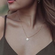 "The Syreni Necklace~  Syreni is Latin for mermaid //  Carry the sea with you wherever you go with our hand forged, water droplet necklace. - 14k gold fill or sterling silver droplet shape  - Hand stamped heart detail  - Simple cable chain, or for a little texture try our beaded chain  - 16\" or 18\" chain. If you would like a 2\" extender added, leave us a note at checkout  - 14k gold fill is nickel-free and suitable for sensitive skin  This piece layers perfectly with our bestselling AURORA ne Dainty Hammered Teardrop Jewelry, Minimalist Hammered Teardrop Jewelry, Delicate Teardrop Charm Necklaces For Everyday, Everyday Delicate Teardrop Charm Necklace, Delicate Drop Jewelry For Everyday, Delicate Drop Jewelry For Everyday Wear, Minimalist Water Drop Jewelry For Everyday, 14k Gold Filled Pearl Drop Teardrop Necklace, Delicate Hammered Teardrop Jewelry