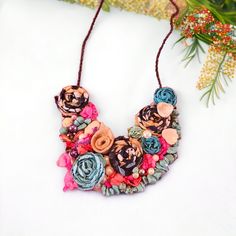 "This necklace is a unique art to wear, handmade necklace with an oversize pendant that has been handcrafted in an avant-garde/boho chic style. It is made of beads, fabric on a felt pad with a metal chain. The pendant size is approximately 4 1/2\" x 4 1/5\" and the necklace length is adjustable (25 1/2\" long). This necklace can be worn on many occasions such as parties, weddings, and other special events. It is a unique piece of jewelry that can add a touch of elegance and sophistication to any Beads Fabric, Gift Love, Art To Wear, Necklace Unique, Unique Jewelry Designs, Wedding Jewellery Necklace, Jewelry Unique, Design Jewelry, Art Unique