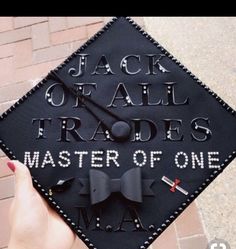 a black graduation cap with the words jack of all trades and master of one written on it