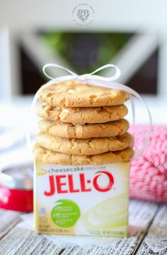 a stack of cookies sitting on top of a table next to a package of jello