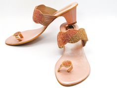 Rose Gold beaded embroidered design strap sandals offer a comfortable sole to walk on. They are beaded with Silver, light gold Rhinestones and Rosegold beads. These shoes are absolutely comfortable and offer a simple yet elegant design. These are perfect for a night out or a simple day. See our page for more of our collection of shoes we offer. We ship out in a timely matter, wrapped in care for a safe secure trip to your location. Thank you for supporting our small business. Shipped from the US Gold Embellished Sandals With Single Toe Strap, Gold Embellished Low Heel Sandals, Elegant Sandals For Summer Festivals, Festive Evening Open Toe Sandals, Elegant Festive Sandals For Summer, Festive Embellished Open Toe Heels, Gold Sandals For Formal Festive Occasions, Gold Formal Sandals For Festive Occasions, Elegant Gold Sandals For Festive Occasions