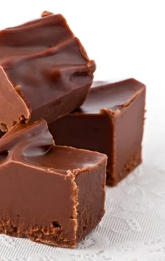 three pieces of chocolate fudge on top of each other