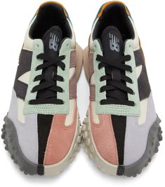 Low-top paneled canvas and suede sneakers colorblocked in multicolor. Round toe. Lace-up closure in black. Logo bonded in grey at padded tongue. Padded collar. Suede logo appliqué in black and purple at sides. Textured rubber trim in brown at heel counter. Foam rubber midsole in taupe. Treaded rubber outsole in grey. Supplier color: Bone/Black New Balance Multicolor Sneakers For Streetwear, Multicolor New Balance Sneakers For Streetwear, Modern Color Block Sneakers For Streetwear, High-top Color Block Sneakers For Streetwear, Color Block High-top Sneakers For Streetwear, New Balance Multicolor Sneakers With Boost Midsole, High-top Leather Sneakers With Color Block, Leather Color Block Sneakers For Streetwear, Low-top Color Block Sneakers For Streetwear