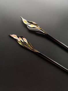 This is an order to make list, please allow 1 week before shipping. Crafted from pure natural ebony wood, the hairpin measures about 16cm in length.  This exquisite hand-painted hairpin features Calla Lily.  The pink calla lily symbolizes everlasting love. The white calla lily represents loyalty and eternal unity. The intricate hand-painted designs are detailed and have a pearl-like luster. The listed price is for one hairpin, and it comes in various patterns to choose from.  Unique gift you can choose for yourself, or your family and friends :-) Chinese Hair Stick, Hairpin Style, Pink Calla Lilies, Chinese Hairpin, Chinese Hair Accessories, Chinese Hair, Hair Fork, Chinese Hairstyle, Wood Accessories