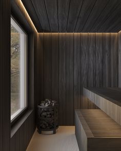 an empty room with wooden walls and steps leading up to the window that overlooks trees