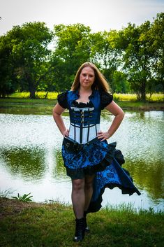 Doctor Who Cosplay: Blue and Black Steampunk skirt This steampunk skirt is being modeled with our Tardis-inspired costume; featuring: a black lace Chemise, Blue demi vest, and our Doctor who inspired corset. Our steampunk skirt is short in the front and long in the back, for that high-low steampunk look. This skirt features fun, flirty ruffles around the edges. We make our skirts with elastic in the waist, which usually fit XS-3X, and the skirt is styled by the corset. Feel free to reach out wit Punk Style Corset For Cosplay Events, Punk Corset For Costume Party And Cosplay Events, Steampunk Cosplay Costume For Fantasy Events, Gothic Fitted Cosplay Costume For Festival, Fitted Gothic Cosplay Costume For Festival, Steampunk Fitted Costume For Alternative Fashion, Fitted Steampunk Costume For Alternative Fashion, Gothic Cosplay Costume With Attached Cancan, Gothic Costume With Attached Cancan For Cosplay