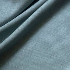 a close up view of the fabric on a bed sheet that has been made to look like linen