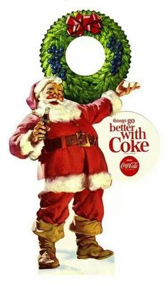 an old fashioned christmas card with santa holding a wreath and a sign that says, there's go the south coke