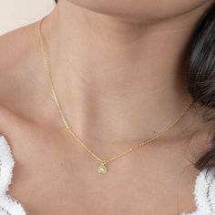 add a classic touch to your everyday style with our 'until I found you necklace'. this dainty, dreamy piece is perfect for everyday layering and the perfect accessory for any occasion - from a casual brunch with friends to a formal meeting. its timeless design ensures it will remain a staple in your wardrobe for years to come. demi-fine 18k gold or rhodium over sterling silver 15" long with a 2" extender chain is 1mm thick pendant is 6mm round Delicate Everyday Charm Necklace With Initial Pendant, Delicate Everyday Charm Necklaces With Initial Pendant, Feminine Charm Necklace With Delicate Chain For Everyday, Feminine Everyday Charm Necklace With Delicate Chain, Everyday Feminine Charm Necklace With Delicate Chain, Feminine Delicate Chain Charm Necklace For Everyday, Elegant Everyday Charm Necklace With Simple Design, Delicate Everyday Necklace With Initial Pendant, Delicate Clavicle Chain Charm Necklace For Everyday