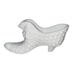 a white ceramic bird shaped dish on a white background