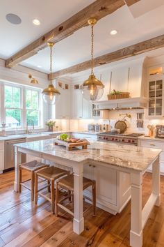 a large kitchen with an island in the middle and two stools next to it