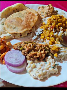 a white plate topped with different types of food