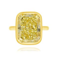 This magnificent ring features a valuable yellow diamond, which reminds us visually of a gold bullion bar. Luxury Gold Diamond Ring With Rectangular Shape, Yellow 14k Gold Diamond Ring, Yellow Diamond Ring In 14k Gold, 14k Gold Yellow Diamond Ring, Fine Jewelry 14k Gold Yellow Diamond Ring, Luxury Yellow Diamond Ring, Luxury Yellow Sapphire Gold Rings, Luxury Yellow Sapphire Diamond Ring Gift, Formal Yellow Cushion Cut Diamond Ring