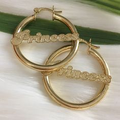 Princess Nameplate Round Hoop Earrings In 14k Authentic Brazilian Gold Filled. Rustic In The Middle. Hypoallergenic, Does Not Tarnish And Great For Sensitive Skin. High Quality. Can Be Use Everyday Or As A Gift For Someone Special. Brand New. Approx Measurements: Diameter Is A Little Bit More Than 1-1/4’ Width 1-1/4’ Lightweight. Feel Free To Ask Any Questions Gold Hoop Earrings With Custom Name, Gold Custom Name Hoop Earrings, Elegant Small Hoop Earrings With Custom Name, Elegant Personalized Huggie Earrings, Personalized Elegant Huggie Earrings, Custom Name Hoop Earrings For Anniversary, Elegant Personalized Hoop Earrings For Anniversary, Personalized Small Hoop Jewelry For Anniversary, Gold Pierced Earrings For Birthday