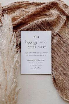 the wedding stationery is laid out on top of an un - dyed piece of fabric