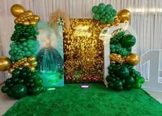 a green and gold themed party with balloons