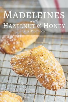 some sugared pastries are on a cooling rack with the words madelienes and hazelnut & honey