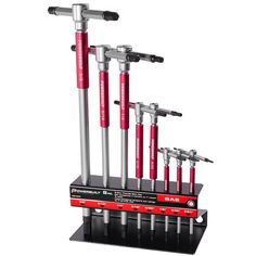 a set of six wrenches on top of each other in a display case with red and silver handles