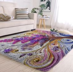 a living room with a white couch and colorful rug