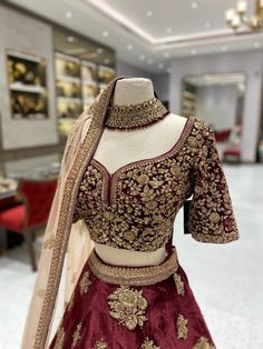 The BL-007 bridal lehenga is a stunning choice for that special day. Featuring intricate detailing and premium fabric, this beautiful lehenga is perfect for traditional ceremonies. Its intricate embroidery and grand silhouette make it an ideal fit for formal events, making a lasting impression. Fabric: Velvet WASH CARE INSTRUCTIONS - Please Dry clean only when it is applicable Ready to Ship! Wedding Sets With Intricate Embroidery In Dola Silk, Embroidered Kundan Gown With Traditional Drape, Wedding Choli With Intricate Embroidery In Kundan, Designer Kundan Lehenga With Intricate Embroidery, Kundan Choli With Intricate Embroidery For Reception, Wedding Sets With Intricate Kundan Embroidery, Wedding Sets With Intricate Embroidery And Kundan, Art Silk Sets With Dabka Work For Wedding, Wedding Choli With Zari Work In Raw Silk