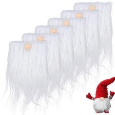 there is an elf with long white hair and a red hat next to the string of lights