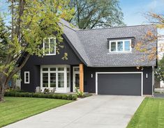 a black house with white trim and windows