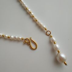 < Pendant Pearl Necklace with Gold Color Metallic Furniture > Very trendy and elegant combination. Necklace can be beautiful accent to any look! > Necklace length - 39 cm (15,3 in) With pendant - 44 cm (17,3 in) > Necklace weight - 20 gm Elegant Handmade Gold-plated Pearl Necklace, Elegant Gold-tone Pearl Chain Necklace, Elegant Yellow Gold-plated Pearl Necklace, Elegant Gold-tone Pearl Necklace With Adjustable Chain, Elegant Gold-colored Brass Pearl Necklace, Neck Jewellery, Summer Necklace, Pearl Pendant Necklace, Vintage Pearls