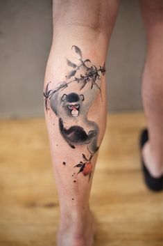 a person with a tattoo on their leg